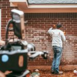 brick restoration mason working on brick discoloration