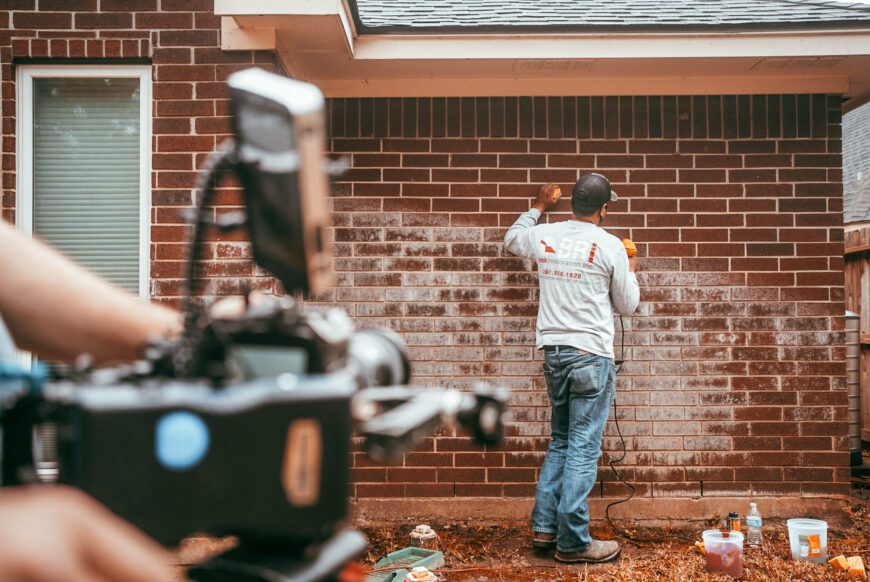 brick restoration mason working on brick discoloration