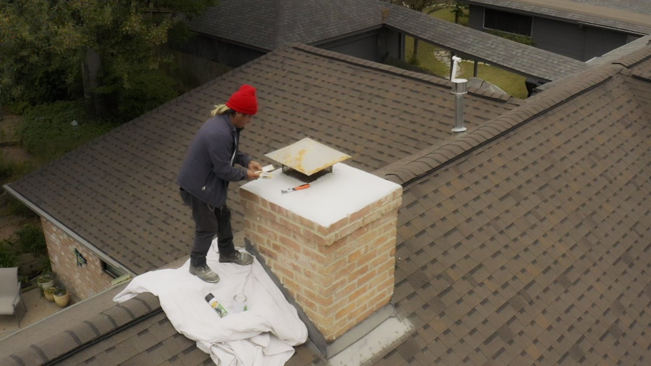 Brick Restoration Masonry Specialist Repairing Chimney on Roof