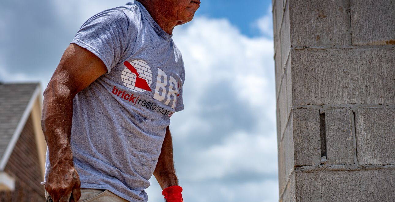 Mason Working on Monument Sign