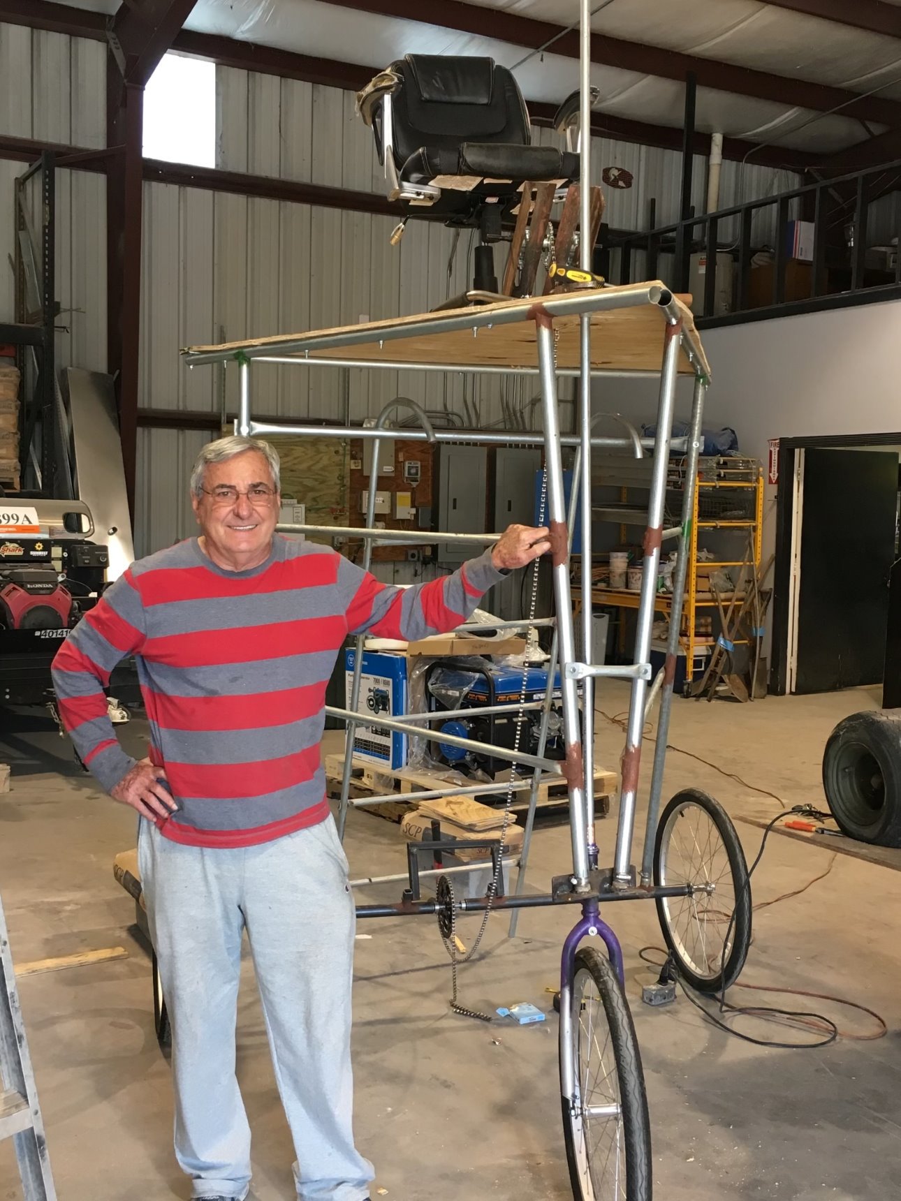 Roberto Standing Next to Invention