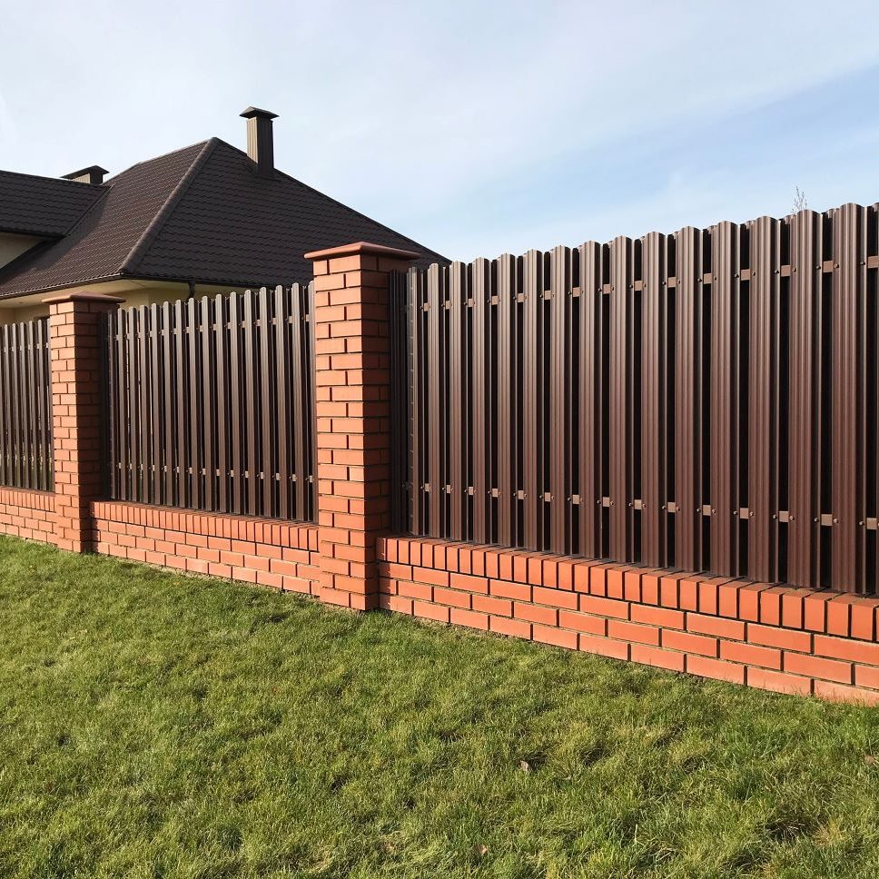 brick perimeter fence with metal slats