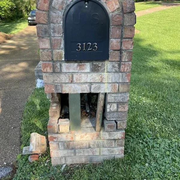 Damaged Brick Mailbox