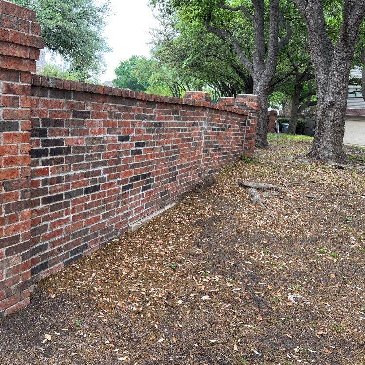 Leaning Brick Perimeter Fence